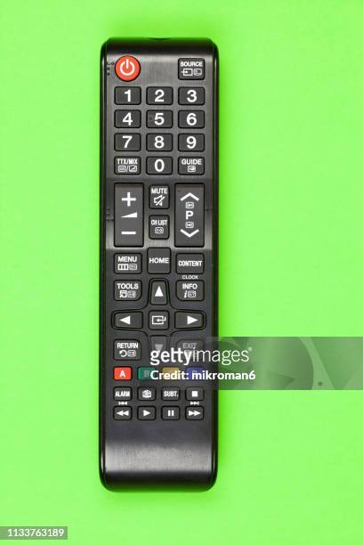 close-up of remote control on table at home - remote controlled fotografías e imágenes de stock