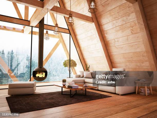 intérieur en bois avec funiture et cheminée - chalet de montagne photos et images de collection