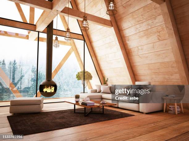 wooden interior with funiture and fireplace - roof beam stock pictures, royalty-free photos & images