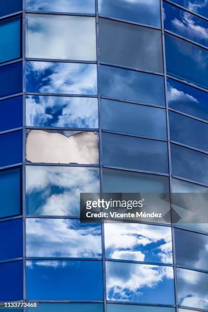 reflections of clouds in skyscrapers - futurista stock pictures, royalty-free photos & images