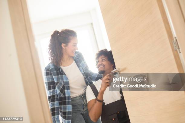 locksmith fixing a door lock - locksmith stock pictures, royalty-free photos & images