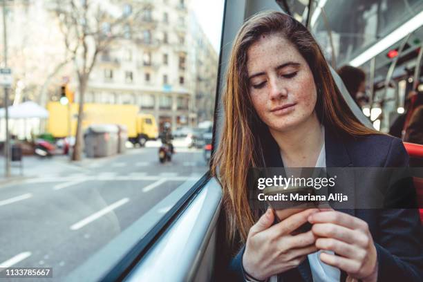 woman walking in the street - showus phone stock pictures, royalty-free photos & images