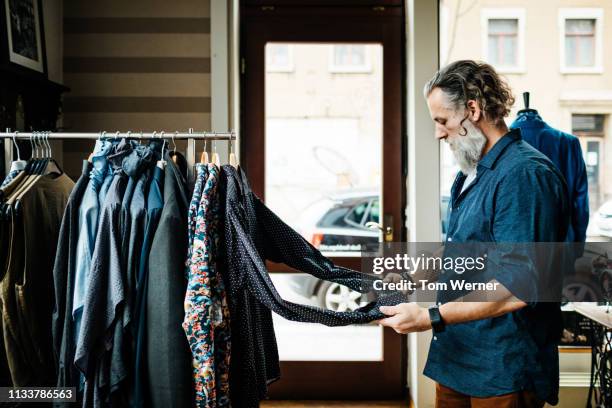 Man Browsing Racks Man Shopping Clothes Rack Photos and Premium High Res Pictures - Getty ...