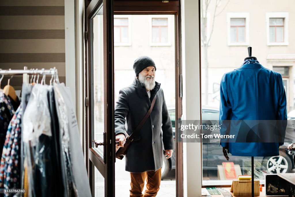 Mature Man Entering Clothing Store