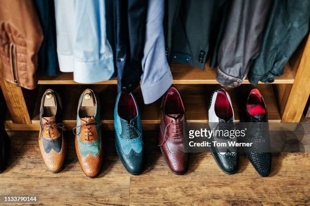 a row of shoes on display - menswear bildbanksfoton och bilder