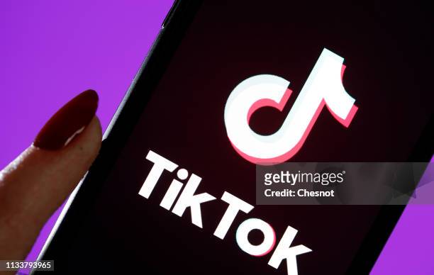 In this photo illustration, the social media application logo, Tik Tok is displayed on the screen of an iPhone on March 05, 2019 in Paris, France....