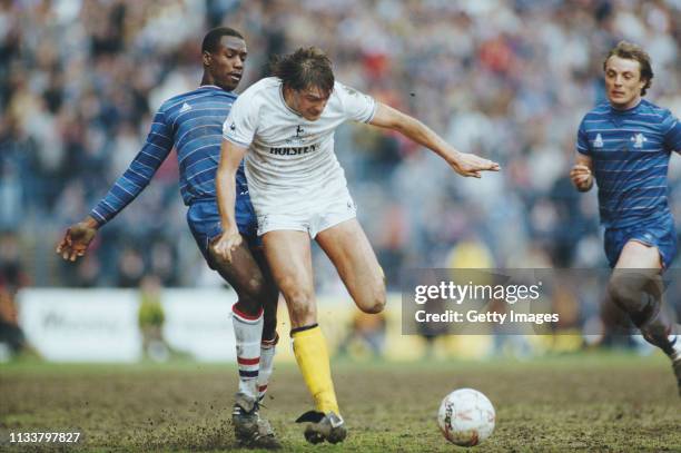 Spurs player Glenn Hoddle is challenged by Chelsea defender Keith Dublin as John Bumstead looks on during a First Division match at Stamford Bridge...
