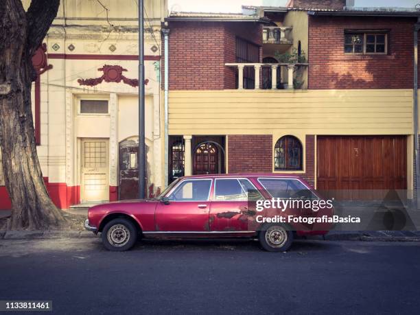 peugeot station wagon parked in the street - estate car stock pictures, royalty-free photos & images