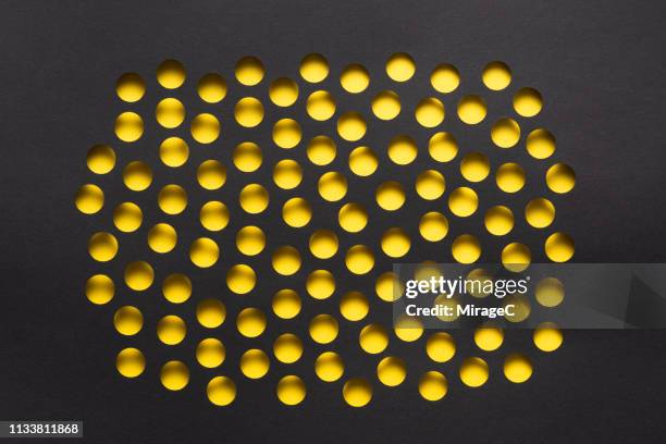 polka dot paper holes - hole punch stock pictures, royalty-free photos & images