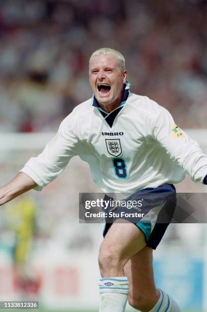 England player Paul Gascoigne celebrates after scoring during the 1996 European Championships Group match against Scotland at Wembley Stadium on June...