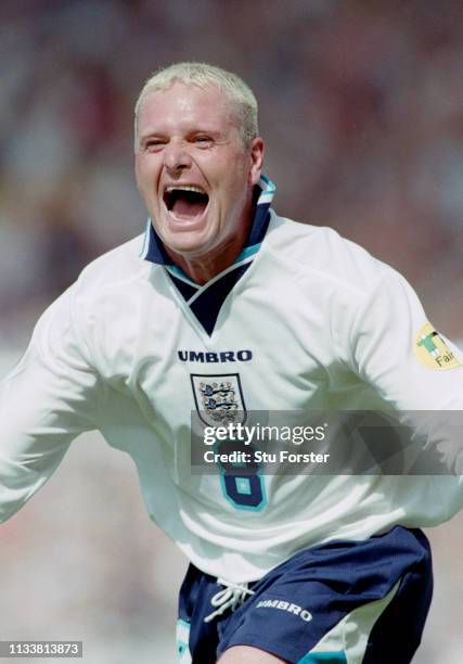 England player Paul Gascoigne celebrates after scoring during the 1996 UEFA European Championships Group match against Scotland at Wembley Stadium on...