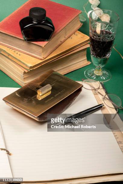 writing desk with blank paper - blank book on desk stock-fotos und bilder