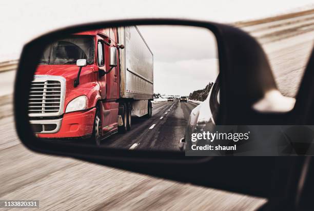 semi truck in mirror - rear view mirror road stock pictures, royalty-free photos & images