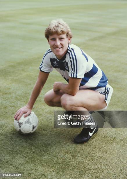 Winger Ian Stewart pictured with an Adidas Tango ball on the artificial turf of Loftus Road in August 1983 in London, United Kingdom.
