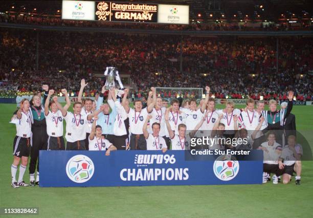 The Germany team celebrate victory after the 1996 UEFA European Championships Final against Czech Republic at Wembley Stadium on June 30, 1996 in...