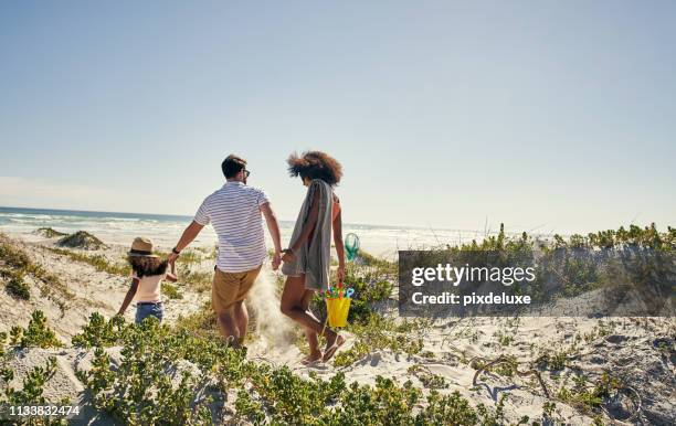 life is more meaningful when spent as a family - beach fun stock pictures, royalty-free photos & images