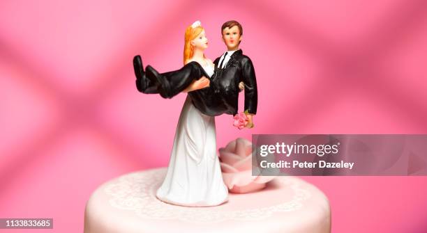 bride and groom wedding figurines - monogamous stock pictures, royalty-free photos & images