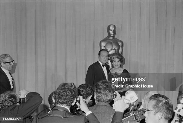 American stand-up comedian, performer and author Bob Hope with American comic actress and singer Martha Raye, winner of the 'Jean Hersholt...