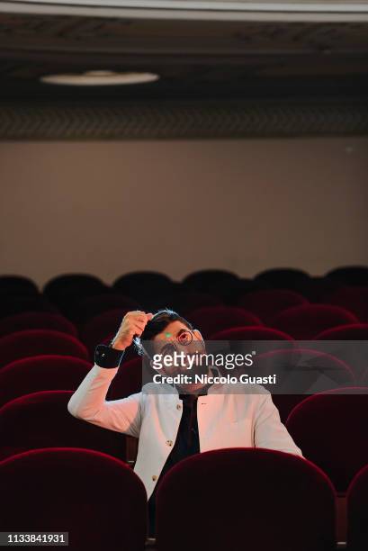 Comedian Manu Sanchez poses with a green gunsight led light in his forehead, during a portrait session in the Theater of Command of a military...