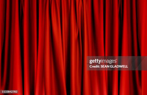 red curtains - red velvet material stock-fotos und bilder
