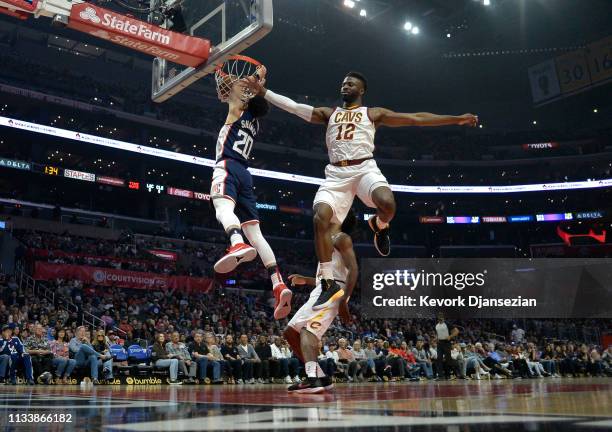 Landry Shamet of the Los Angeles Clippers scores a basket against David Nwaba of the Cleveland Cavaliers during the first half at Staples Center on...