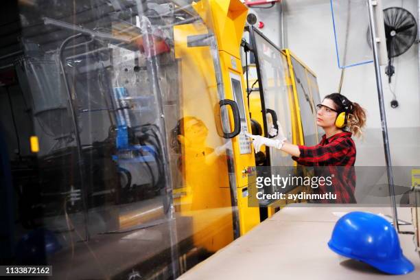woman working in a factory - mould stock pictures, royalty-free photos & images