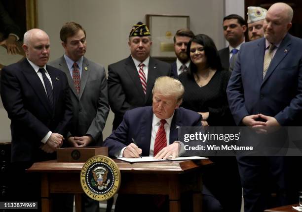 President Donald Trump signs an executive order at the White House on the “National Roadmap to Empower Veterans and End Veteran Suicide” March 5,...