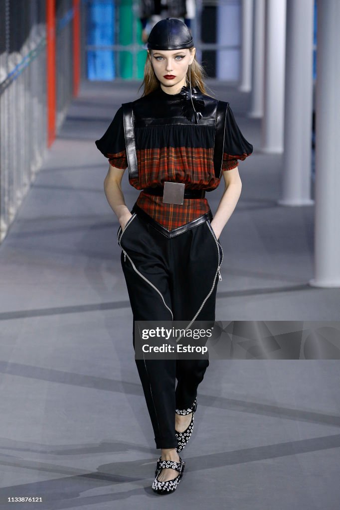 A model walks the runway at the Louis Vuitton show at Paris Fashion ...