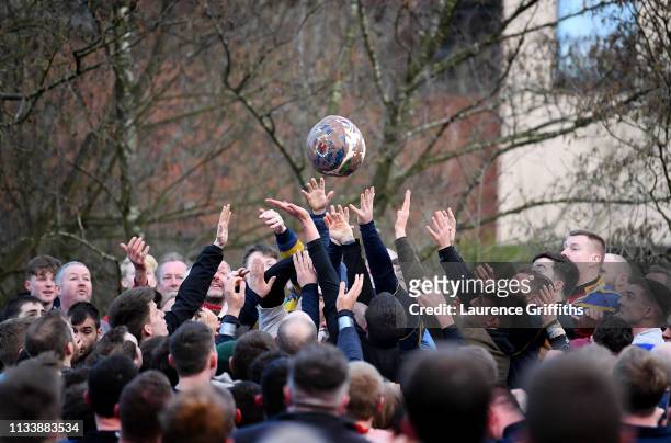 Rival teams 'Up'ards' and 'Down'ards' battle for the ball during the Royal Shrovetide Football match in Ashbourne, Derbyshire, England on March 05,...