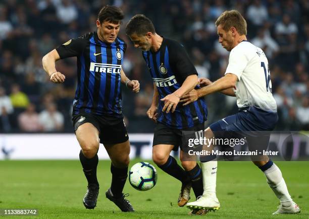 Allan Nielsen of Spurs Legends competes for the ball with Benito Carbone and Javier Zanetti of Inter Forever during The Legends Match between Spurs...