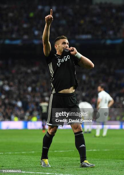 Dusan Tadic of Ajax celebrates as he scores his team's third goal during the UEFA Champions League Round of 16 Second Leg match between Real Madrid...