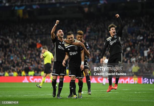 Dusan Tadic of Ajax celebrates as he scores his team's third goal with team mates during the UEFA Champions League Round of 16 Second Leg match...