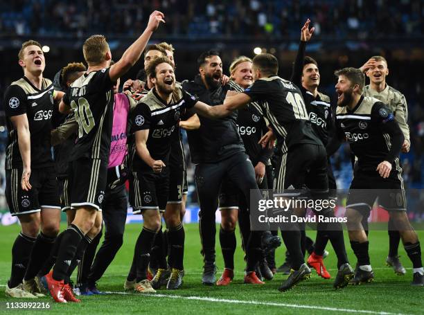 Ajax players celebrate victory after the UEFA Champions League Round of 16 Second Leg match between Real Madrid and Ajax at Bernabeu on March 05,...