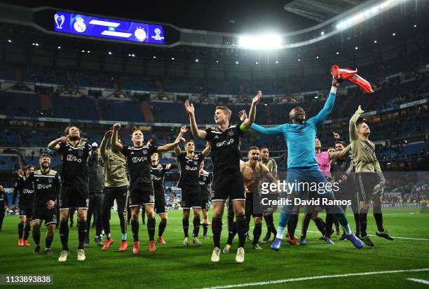 Ajax players celebrate victory after the UEFA Champions League Round of 16 Second Leg match between Real Madrid and Ajax at Bernabeu on March 05,...