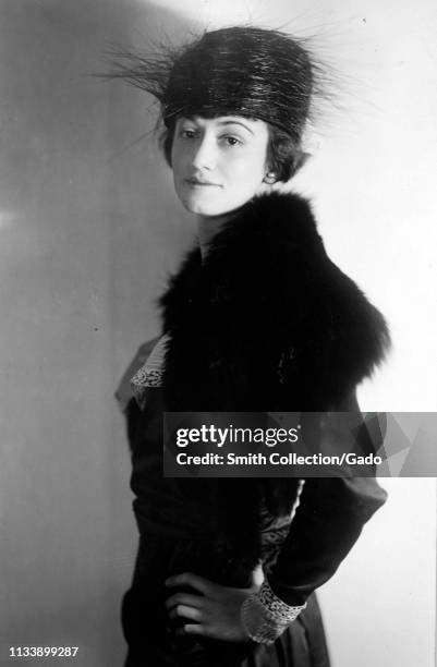 Profile portrait, from the waist up, of Helen Wallace wearing a fur cape and hat, with her head turned to face the camera, 1925. Image courtesy...
