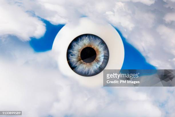 eye looking through clouds - big brother imagens e fotografias de stock