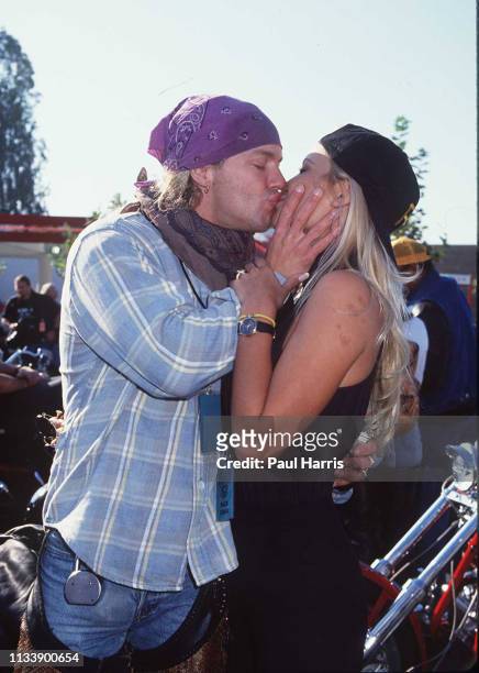 Baywatch actress Pamela Anderson kisses boyfriend Bret Michaels at the Aids benefit "Love Ride 2". November 9, 1994 Castaic Lake, California
