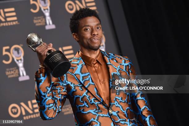 Outstanding Actor in a Motion Picture for Black Panther Chadwick Boseman poses with his award in the press room during the 50th NAACP Image awards at...