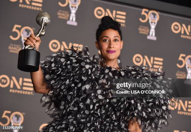 Outstanding Actress in a Comedy Series for Black-ish Tracee Ellis Ross poses with her award in the press room during the 50th NAACP Image awards at...