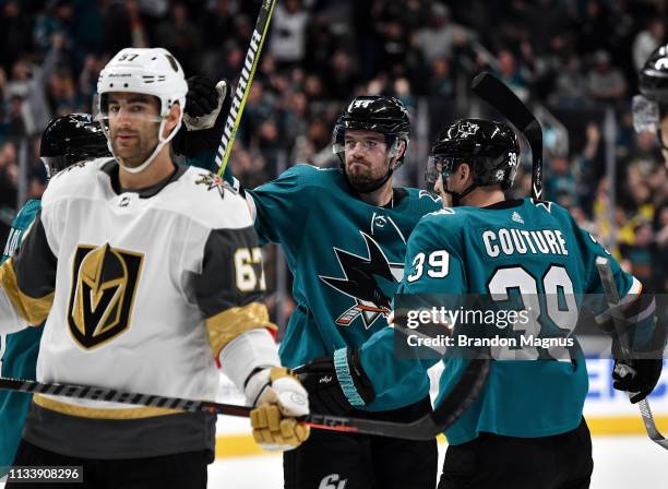 Marc-Edouard Vlasic, Joonas Donskoi, Logan Couture and Brent Burns of the San Jose Sharks celebrate scoring a goal against the Vegas Golden Knights...