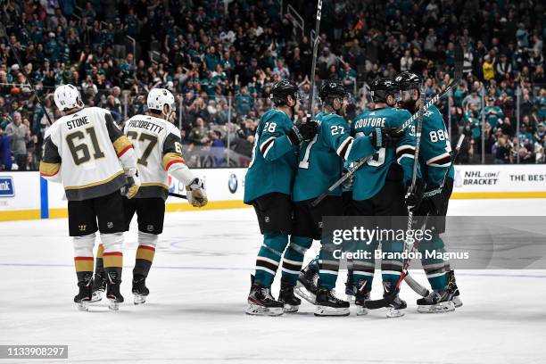 Marc-Edouard Vlasic, Joonas Donskoi, Logan Couture and Brent Burns of the San Jose Sharks celebrate scoring a goal against the Vegas Golden Knights...