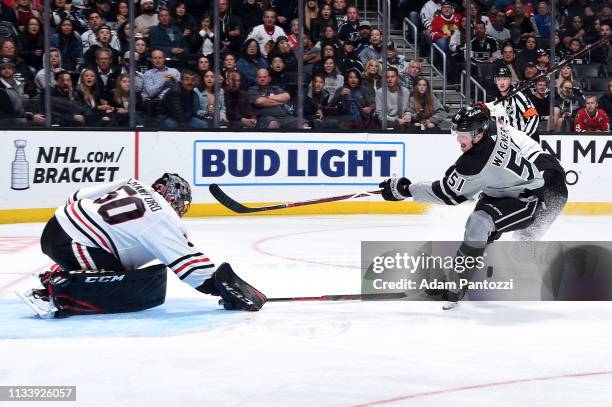 Goaltender Corey Crawford of the Chicago Blackhawks makes the save against Austin Wagner of the Los Angeles Kings during the third period of the game...