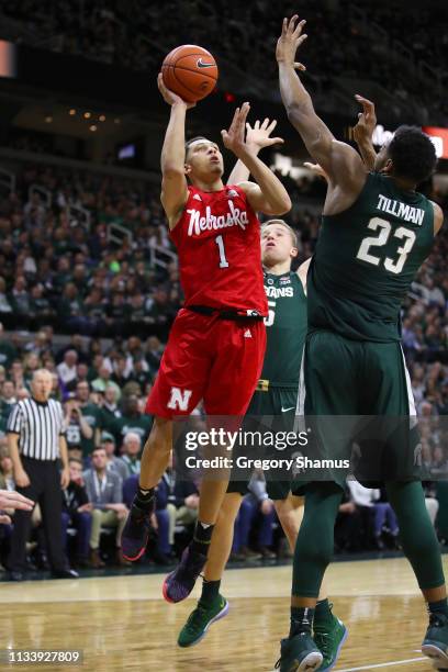 Amir Harris of the Nebraska Cornhuskers tries to get a shot off over Xavier Tillman of the Michigan State Spartans during the second half at Breslin...