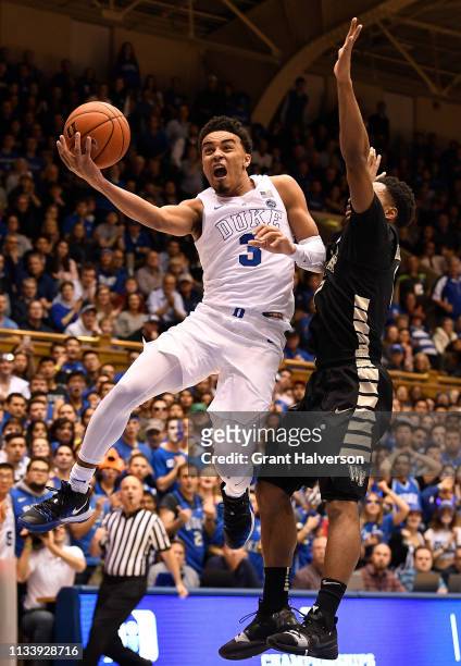 Tre Jones of the Duke Blue Devils drives against Brandon Childress of the Wake Forest Demon Deacons during the second half of their game at Cameron...