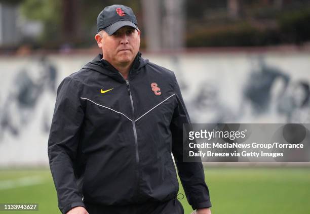 Trojans head coach Clay Helton walks off the field following USC's first spring football practice on campus in Los Angeles on Tuesday, Mar. 5, 2019.