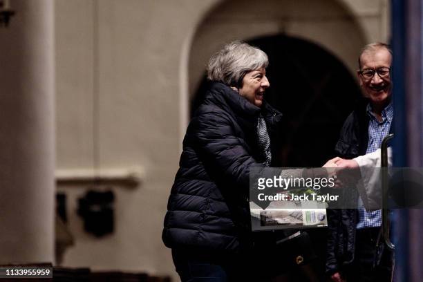British Prime Minister Theresa May shakes the vicar's hand she leaves following a Sunday church service on March 31, 2019 in Maidenhead, England. MPs...