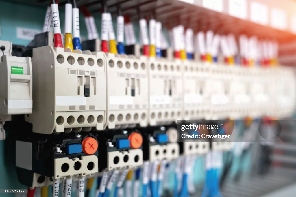 Magnetic breakers. Electrical background . Control panel with wiring.
