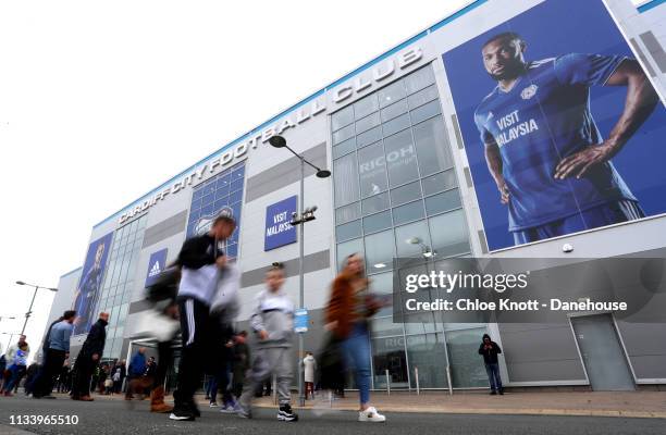 Fans arrive at the stadium ahead of the Premier League match between Cardiff City and Chelsea FC at Cardiff City Stadium on March 31, 2019 in...