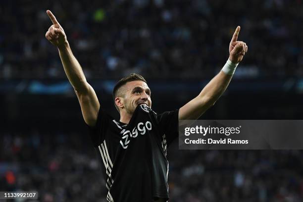 Dusan Tadic of Ajax celebrates after scoring his team's third goal during the UEFA Champions League Round of 16 Second Leg match between Real Madrid...