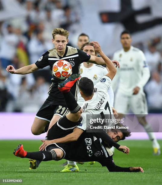 Lucas Vazquez of Real Madrid CF competes for the ball with Frenkie De Jong and Nicolas Tagliafico of Ajax during the UEFA Champions League Round of...